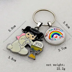 Macro detail of rainbow school-themed metal keychain with angel charm for kids