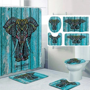Detail of 4-piece bathroom set with colorful Indian elephant print on turquoise wood background