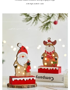Detail of wooden Christmas ornament with LED star lights, Santa and reindeer figures