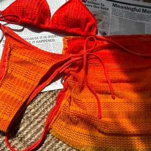 Close-up of orange gradient bikini set with wave texture and drawstring beach skirt