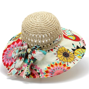 Women's wide brim straw hat with bohemian floral print and decorative ribbon bow