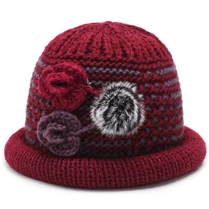 Winter knitted hat in wine red with purple stripes and decorative floral accents