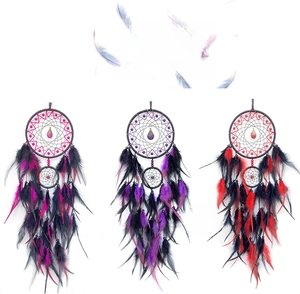 Detail showing high-end handmade dreamcatcher with natural feathers and beads in three colors