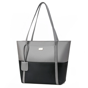 Minimalist soft PU leather tote bag in grey and black patchwork with shoulder strap