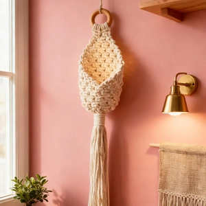 Handwoven macrame wall hanging basket with cotton rope fringe for home decor