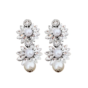 Exquisite silver flower earrings set with sparkling crystals and elegant white pearls