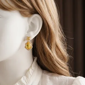 Vintage style drop earrings with yellow waterdrop gemstone and crystal floral studs