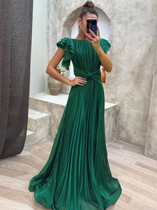 Elegant emerald green pleated evening maxi dress with tiered ruffle sleeves and waist detail