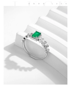 Macro detail showing S925 hallmark on the silver band with green emerald zircon