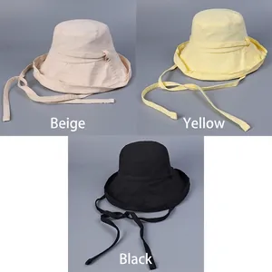 Cotton sun hats for women with adjustable chin straps in beige, yellow, and black colors