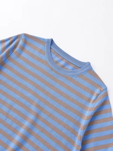 Detail of round neckline and soft blue-brown striped knit texture on a short sleeve top