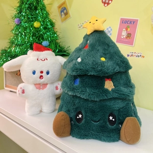 Detail of plush Christmas tree and bunny pillows for festive sofa holiday decoration