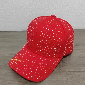 Detailed macro view of vibrant red baseball cap with colorful rhinestone embellishments