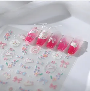 Detailed relief nail stickers featuring pink bows, rabbits and floral lace designs