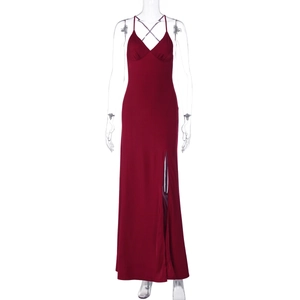 Detailed close-up of the deep V-neckline and high slit on a wine red sexy backless slip dress