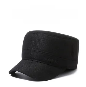 Detail of warm winter flat top cap featuring thick fabric and sport side label