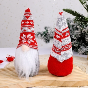 Christmas gnome dolls with snowflake knit hats and white beards on wooden tray decor