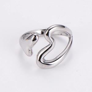 Detail of silver hollow heart open ring with unique abstract metallic streamline design