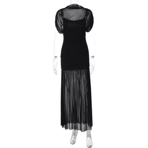 Detail view of black mesh patchwork maxi dress with elegant pleats and sheer sleeves