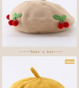 Detail view of baby knit beret hats in khaki with cherry and yellow pointed style