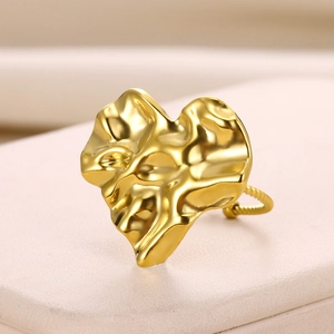 Detailed close-up of an irregular gold heart ring featuring a unique wrinkled metal texture