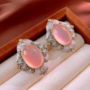 Vintage style gold plated diamond earrings with pink cat eye stone and white enamel detail