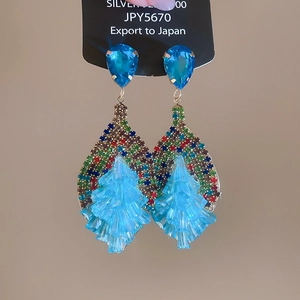 Macro detail of Bohemian crystal drop earrings with multicolor rhinestones and S925 silver pin