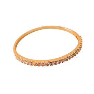 24K gold plated minimalist bangle with pavé-set round zircons on white background