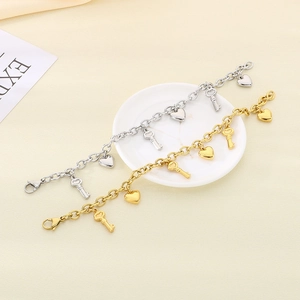 Fashionable stainless steel heart and key pendant bracelet set in gold and silver