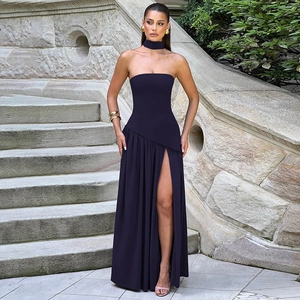 Elegant strapless high slit dress in deep purple with matching choker on stone steps