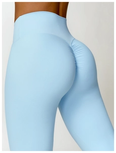Detail of high waisted sky blue yoga pants with scrunch butt lifting seam design