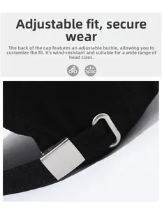 Detail of black baseball cap with adjustable silver metal buckle on back strap