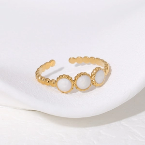 Gold minimalist open ring with three white circular inlays for a sleek feminine look