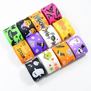 Flat lay of colorful Halloween polyester ribbons with pumpkin and ghost patterns
