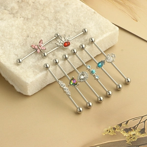 Set of stainless steel industrial barbell piercings with butterfly, crown, and heart motifs