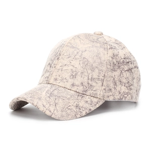 Detail view of off-white faux suede baseball cap with grey marble texture and curved brim