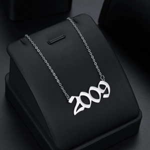 Polished stainless steel 2009 year pendant necklace with adjustable O-chain for women