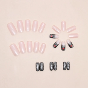 Christmas reindeer press-on nails in medium square shape with black glitter and pink matte