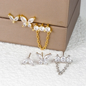 Detailed view of butterfly zircon stud earrings with chain in gold and silver plating