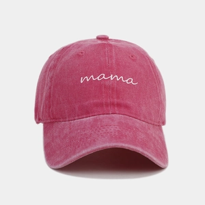 Close-up of vintage rose red washed cotton baseball cap with white mama embroidery