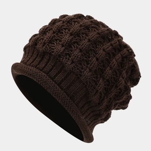 Detail of coffee brown knit beanie featuring thick honeycomb weave and rolled cuff edge