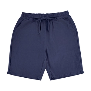 Detailed view of navy blue linen shorts featuring elastic waistband and drawstring