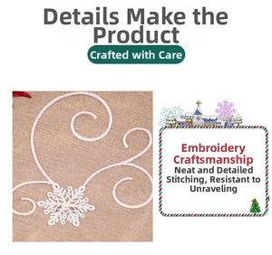 Detail of Christmas table runner with white snowflake embroidery and pearl on linen fabric