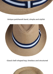 Detailed view of weave texture and striped ribbon on summer straw fedora hat