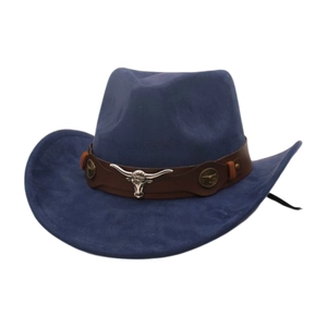 Detail of silver bull head ornament and vintage badges on blue suede cowboy hat
