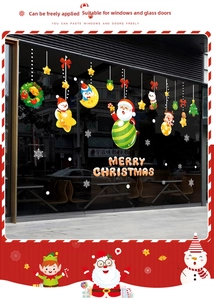 Detail of Christmas window stickers featuring Santa, snowman, and reindeer on glass