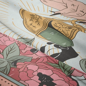 Macro detail of bohemian tapestry showing pink peonies and golden floral patterns