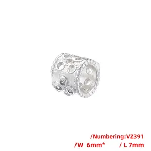 Detailed view of silver hollow cylinder bead with sparkling cubic zirconia, 6mm by 7mm