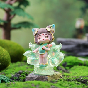Macro shot of Nine-Tailed Fox figure with pearlescent teal resin and gold details
