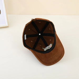 Inside view of brown corduroy kids baseball cap showing 100% cotton lining and stitching
